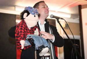 Andi Markham of Kids UK delivering a Christmas message with Jack on the Sutton Rose Luxury Care Home Main Stage. Picture: Richard Harris Photography 
