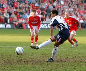 Robert Earnshaw slots home a penalty.
