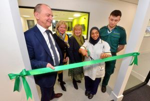 The ribbon at the new training centre is cut by student Fuzia Bi