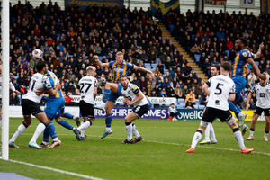 Chey Dunkley of Shrewsbury Town scores a goal to make it 1-1 (AMA)