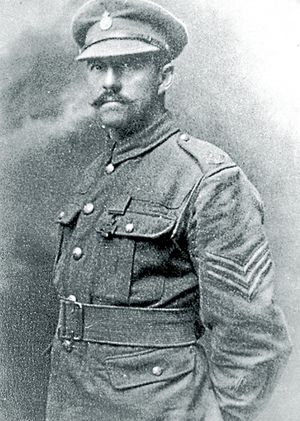Sergeant Harold Whitfield with his Victoria Cross, and proudly wearing the Shropshire Yeomanry cap badge.