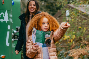 A child using a leaflet to explore Wyre Forest