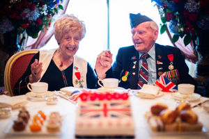 Ruth Bourne, 98 and Bernard Morgan, 100, hold hands as they join Second World War veterans at a tea party organized by the Royal British Legion at The Ritz, London.