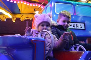Tyler, five, and Tilly, two, Scott enjoying one of the rides