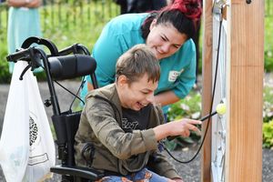 Staff helping bring smiles to children with life-threatening conditions in the space.