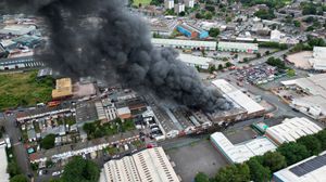 Black smoke pours into the sky from the fire at GB Tyres in West Bromwich. Photo: Tim Thursfield