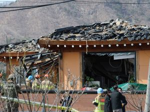 Rescue members work at a bomb accident site where a South Korean fighter jet accidentally dropped bombs on a civilian area during training, in Pocheon, South Korea