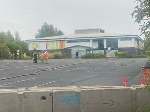 Firefighters shortly after the blaze appeared to have been tackled