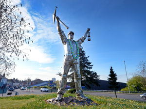 Supporting image for story: Miner statue turns blue for baby killed when his pram was hit by car