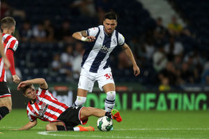 Okay Yokuslu of West Bromwich Albion and James McAtee of Sheffield United during the Carabao Cup First Round match between West Bromwich Albion and Sheffield United at The Hawthorns on August 11, 2022 in West Bromwich, England. (Photo by Adam Fradgley/West Bromwich Albion FC via Getty Images).