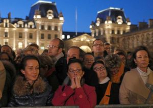People gather outside for a national service at Notre Dame cathedral
