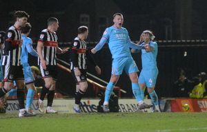 Kacper Lopata celebrates Priestley Farquharson's opener for Walsall.