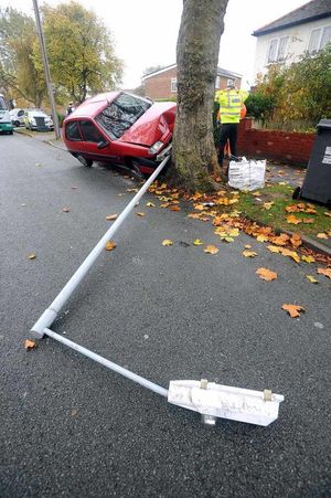 A rapid response vehicle was sent to the scene, but the driver escaped with only minor injuries. As these dramatic pictures show, the lamp post was snapped in two due to the force of the crash. It was left lying across the pavement following the accident which left the red vehicle tottering on two wheels, half balanced against the tree.nextpage