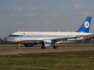 An Azerbaijan Airlines plane on an airport runway