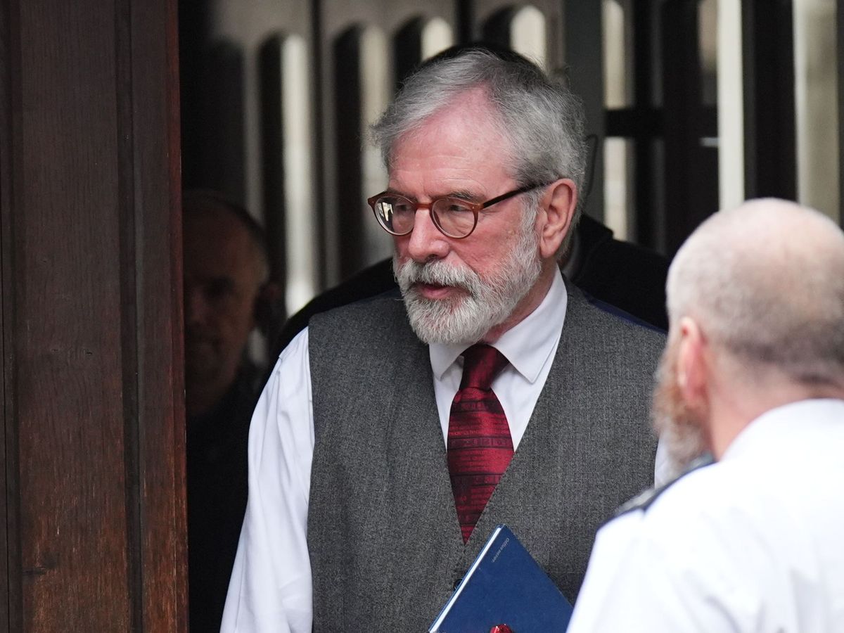 Gerry Adams arrives at High Court for bombings trial