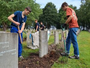 Supporting image for story: Teenagers tend to military graves together in decades-long friendship