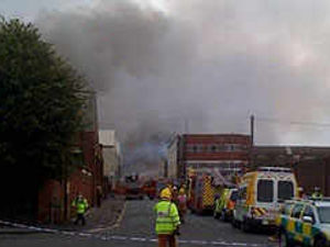 Supporting image for story: Over 200 battling big blaze