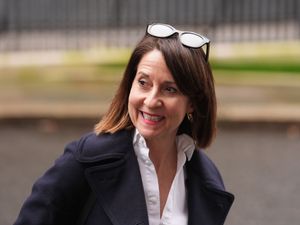 Liz Kendall smiles as she leaves a Cabinet meeting