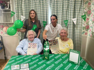 Residents Joan and Pat at HC-One’s Sedgley Court Care Home, who are the home’s Macmillan Charity Champions requesting cake donations to sell at the cake sale on the 26th 