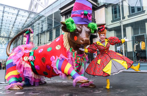 Panto Dame Andrew Ryan meets the Bull outside the Bullring in Birmingham City Centre.