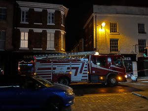 Three fire engines and two police cars were still at the scene of the fatal Shrewsbury fire this morning