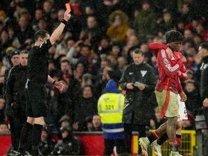 Patrick Dorgu is shown a red card