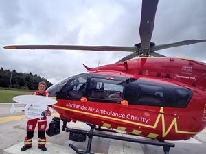 Supporting image for story: Telford law firm donates over £3,000 to help keep air ambulance flying high