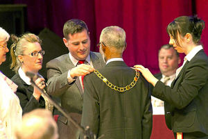 Outgoing mayor Councillor Kevin Guy hands over the chain of office to Councillor Leon Murray