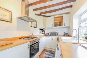 The kitchen leads out to the shared back garden