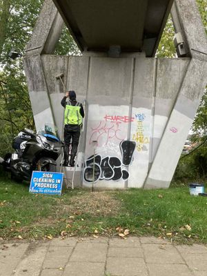 John Edwards, otherwise known as ‘The Sign Guy’, has completed his latest challenge by painting the underside of the Frankwell Footbridge