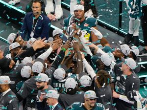 The Philadelphia Eagles celebrate with the Vince Lombardi Trophy after their win against the Kansas City Chiefs