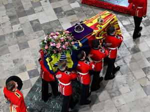 Supporting image for story: What's on the Queen's coffin: The crown, flag and flowers used for funeral service