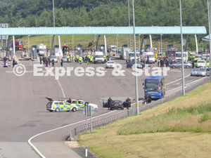 Supporting image for story: M6 terror alert: Coach passenger seen 'pouring liquid into smoking bag'