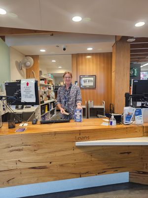 Mobile driver Joanne at the Bairnsdale Library service desk with the returned book