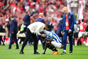 Carlos Corberan (left) consoles his players after defeat after the final whistle in the Sky Bet Championship play-off final at Wembley Stadium, London. Picture date: Sunday May 29, 2022.
