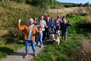 Campaigners are celebrating after plans to build on Damson Wood have been rejected. At the front is: Elliott Powell and with him are local residents: Marie Thompson, Clive Luty, David Bowden, Peter Lockley, Kath Thacker,Pam Lockley, Marie Thompson. Daryly Bowden and Lynda Lord and their dogs