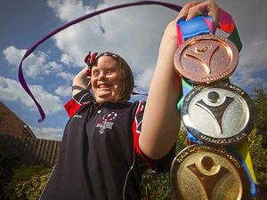 Supporting image for story: Gymnast Elizabeth's a golden girl
