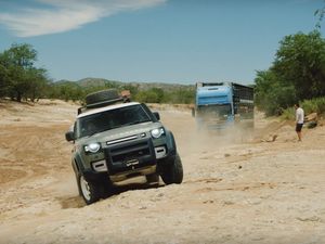 Supporting image for story: Watch two 2020 Land Rover Defenders rescue a trucker from a dry river bed
