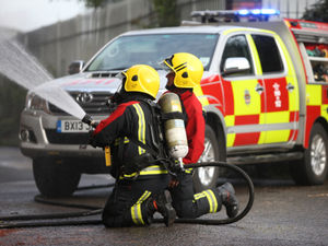 Supporting image for story: Dozens of firefighters battle major factory blaze in city