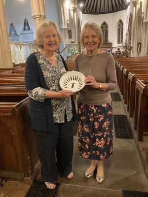 Philippa being presented with her bowl by Marches Choir Chairman Heather Willis. Photo: Holly Godman