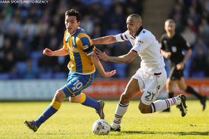 Louis Dodds of Shrewsbury Town and Darren Pratley of Bolton Wanderers