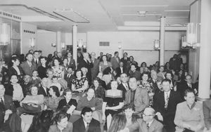 Wayne and Fay on a transatlantic journey on the Queen Elizabeth. They are second row, just right of centre