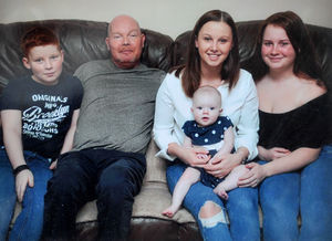 Jess pictured with her dad Anthony and family members