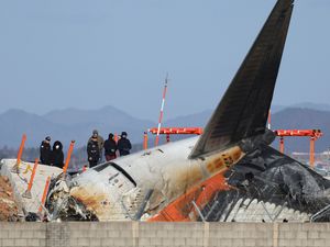 Supporting image for story: US and Boeing investigators examine site of deadly South Korean plane crash