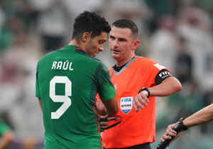 Match referee Michael Oliver shows his watch to Mexico's Raul Jimenez at full-time after the FIFA World Cup Group C match at the Lusail Stadium in Lusail, Qatar. Picture date: Wednesday November 30, 2022.