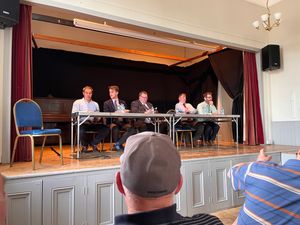 Mr Lewis - far left - at a pre-election hustings in Montgomery Town Hall last year.