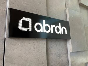 A sign bearing the Abrdn brand and logo