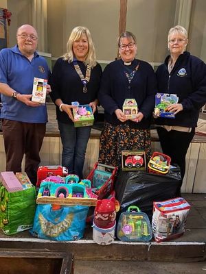Pictured (left to right): Lion Peter Fielding, Club President Debra Coburn, Rev. Jules Smith, and Mandy Shaw, who will soon be welcomed as our newest member.