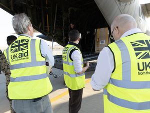 UK aid workers wearing hi-vis vests