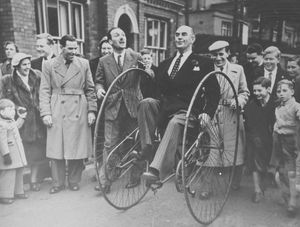 George, on the left, with moustache and tie, watches as the famous broadcaster Kenneth Horne tries out an unusual form of transport in Tan Bank, Wellington. The occasion was the launching of a cycling proficiency scheme in the 1950s – George was at the time chairman of the road safety committee of Wellington Urban District Council.